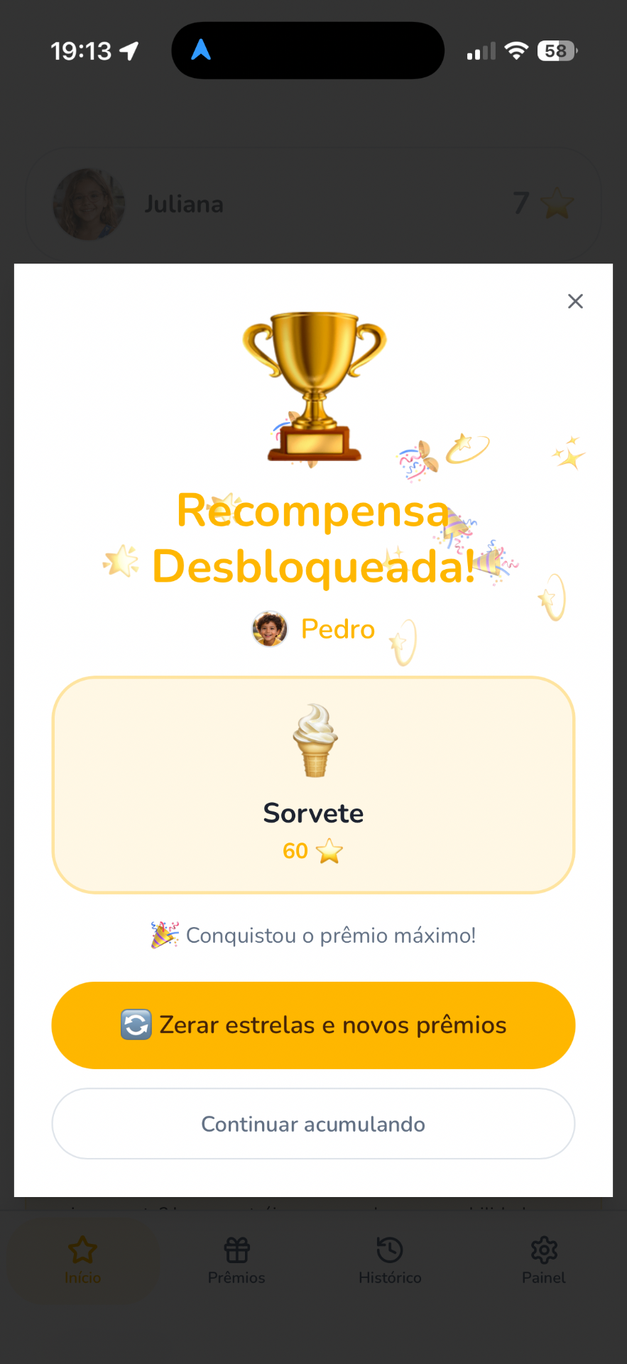 Modal de recompensa desbloqueada no app Estrelinhas celebrando conquista da criança